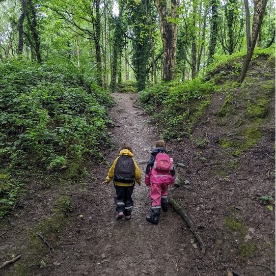 Children exploring nature at Out in the Sticks Forest School